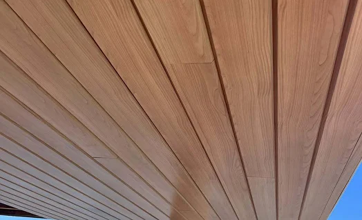 Close view of woodgrain aluminium boards on a soffit