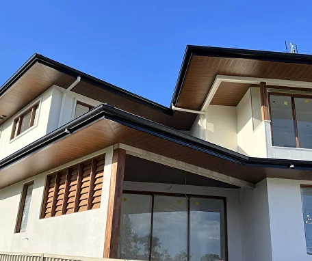 Home exterior finished with woodgrain aluminium cladding and soffits