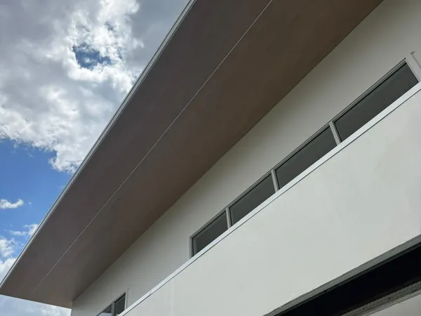 Woodgrain aluminium soffit under a skillion roof on a build in progress