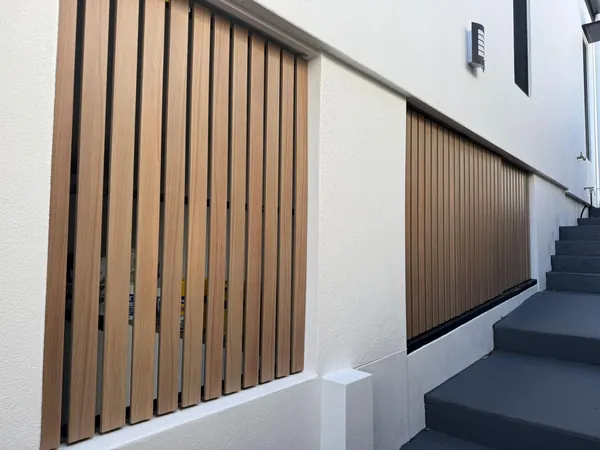 Vertical aluminium batten screens on a building facade